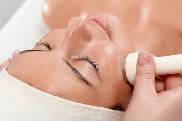 Microdermabrasion Treatment A person relaxing during a non-invasive microdermabrasion session, symbolizing the gentle rejuvenation of skin for a brighter complexion.